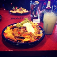 Photo taken at Mango&#39;s Taqueria and Cantina by Gloriana L. on 9/16/2012