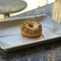 Photo taken at Revolution Doughnuts &amp; Coffee by Jasper Y. on 4/20/2018