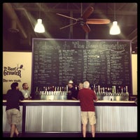 Photo taken at The Beer Growler by km q. on 9/16/2012