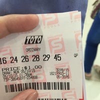 Photo taken at Singapore Pools @ Lucky Plaza by Lora G. on 10/5/2015