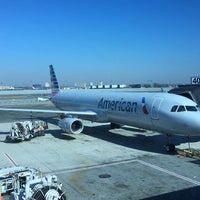 Photo taken at Gate 40 by Andre H. on 3/9/2016