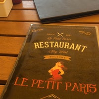 Photo taken at Le Petit Paris by Karen B. on 3/28/2018