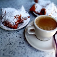 Photo taken at Café du Monde by Sara L. on 5/5/2013