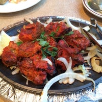 Photo taken at Mughlai Restaurant by Vina C. on 2/8/2014