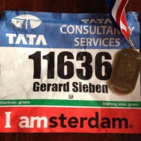 Photo taken at Amsterdam Marathon [Finish] by G S. on 10/20/2013