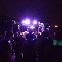 Photo taken at LivingSocial 5k glow in the dark dance party by Jingran Z. on 6/23/2013