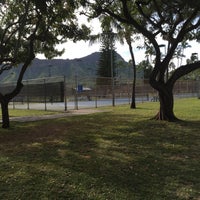 Photo taken at Kapiolani Park Tennis Courts by §uz E. on 4/29/2018