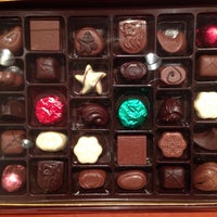 Photo taken at Godiva Chocolatier by Denise C. on 12/23/2013