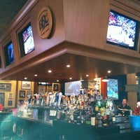 Photo taken at Champions Sports Bar by Stacy F. on 12/29/2012