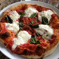 Photo taken at Olio Wood Fired Pizzeria by Michelle H. on 4/15/2013