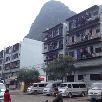 Photo taken at Yangshuo Bus Station by Evgeny Z. on 11/25/2012