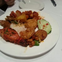 Photo taken at Saffron Indian Cuisine by Tammy H. on 12/25/2012