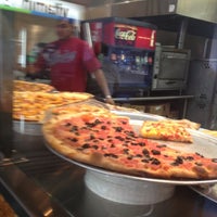 Photo taken at Slices Pizza by Juliet M. on 10/30/2012