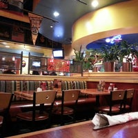 Photo taken at Red Robin Gourmet Burgers and Brews by Dewey C. on 12/21/2012