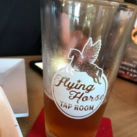 Photo taken at Flying Horse Taproom by Susie K. on 7/14/2019