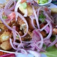 Photo taken at Pisco Mar Restaurante Peruano by Carolina A. on 10/14/2012