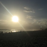 Photo taken at Barra da Tijuca Beach by Joey T. on 1/21/2016
