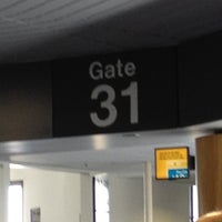 Photo taken at Gate 31 by JiHee A. on 4/18/2012
