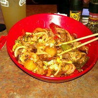 Photo taken at Genghis Grill by Öbec A. on 3/23/2012