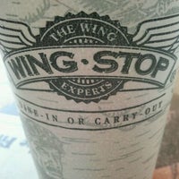 Photo taken at Wingstop by Moises Q. on 3/3/2012