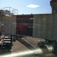 Photo taken at Gate A4 by Dedra M. on 8/9/2012