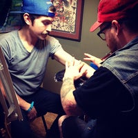Photo taken at Unbreakable Tattoo by Kelly C. on 4/12/2013