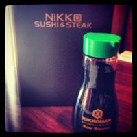 Photo taken at Nikko Sushi + Sake Lounge by Lauren Y. on 3/15/2013