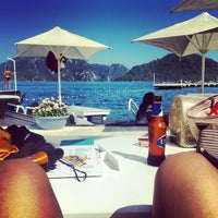 Photo taken at Palace Beach Club by -gulcan- on 6/25/2013