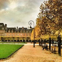 Photo taken at Place des Vosges by Carlos P. on 11/15/2013