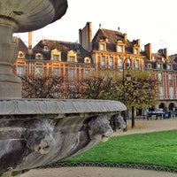 Photo taken at Place des Vosges by Carlos P. on 11/20/2013