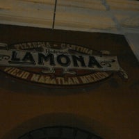 Photo taken at La Mona Pizzeria Cantina by Erik L. on 5/8/2013