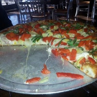 Photo taken at crust pizzeria by Jonathan A. on 11/12/2012