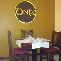 Photo taken at Onix Restaurante Bar by Andrea on 3/29/2013
