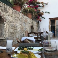 Photo taken at Malades Restaurant by E. A. on 7/20/2018