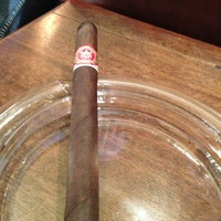 Photo taken at Downing Street Pub &amp;amp; Cigar Bar by Bill H. on 12/20/2012