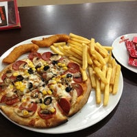 Photo taken at Pizza Pizza by r@yh@n on 11/12/2012