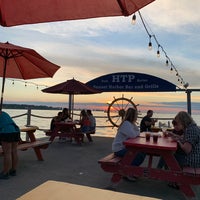Photo taken at Sunset Harbor Bar &amp;amp; Grille by Jon C. on 6/20/2020