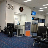 Photo taken at Gate 24 by Alexandrei R. on 12/18/2012