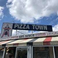 Photo taken at Pizza Town USA by Katie V. on 8/3/2018