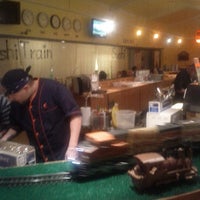 Photo taken at Sushi Train by David H. on 9/16/2012