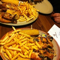 Photo taken at Nando&amp;#39;s by Victoria S. on 12/28/2012