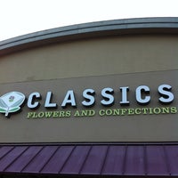 Photo taken at Classics Flowers and Confections by Leisa O. on 12/3/2012