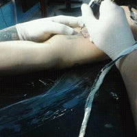 Photo taken at 280a Tattoo Studio by Vanessa C. on 10/21/2012