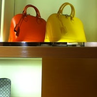 Photo taken at Louis Vuitton by Velma on 12/8/2012
