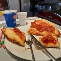 Photo taken at Caribic Pizza by Alex J. on 9/10/2022