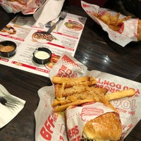 Photo taken at Red Robin Gourmet Burgers and Brews by Andrew F. on 12/19/2021