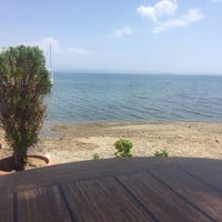 Photo taken at New Moon Beach Club by Elif T. on 6/7/2018
