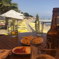 Photo taken at New Moon Beach Club by Elif T. on 6/9/2018