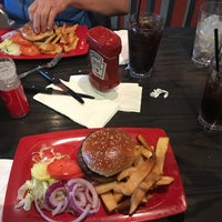 Photo taken at Red Robin Gourmet Burgers and Brews by Andrea A. on 8/19/2022