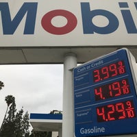 Photo taken at Mobil by Christy A. on 7/21/2018